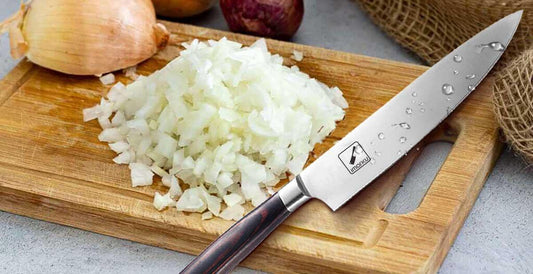 cutting onion with a chef knife
