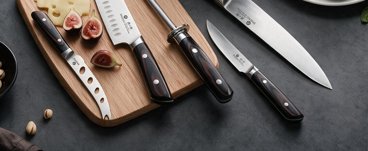 Imarku assorted kitchen knives set, santoku, cheese knife, paring knife on cutting board