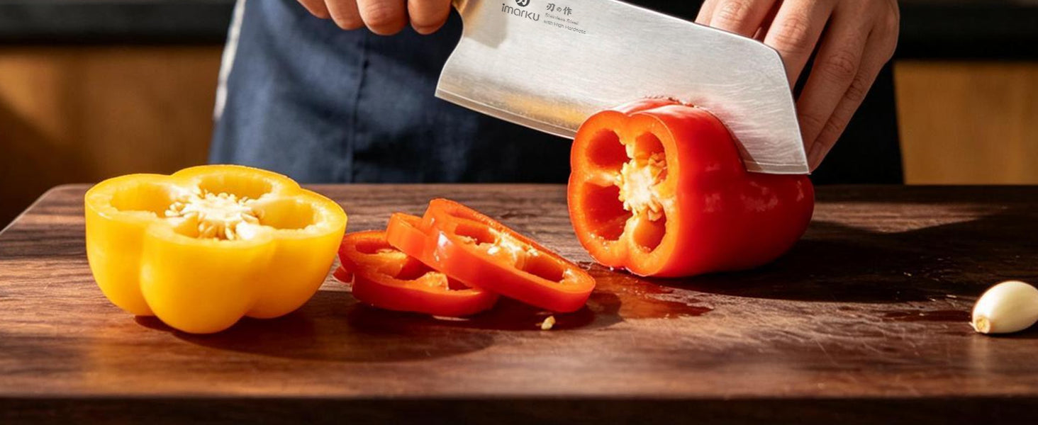 Imarku stainless steel cleaver slicing bell peppers on wood board
